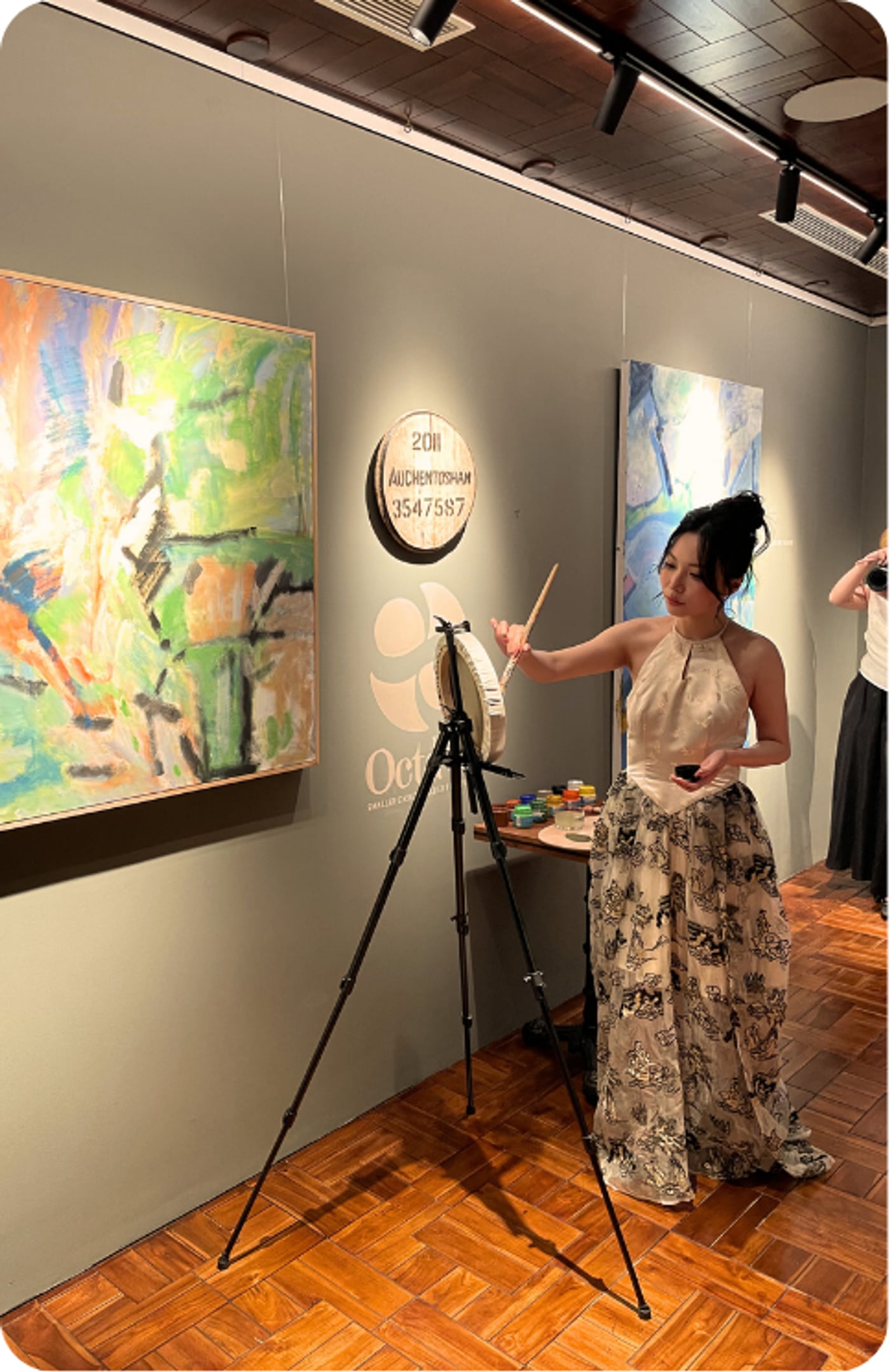 The hand-painted bottle, made live during the exhibition.